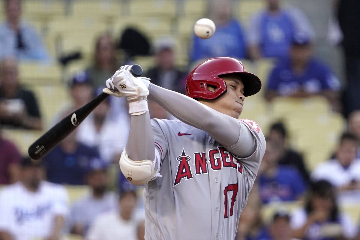 Angels' Shohei Ohtani hits a foul ball during the first inning against the Dodgers.