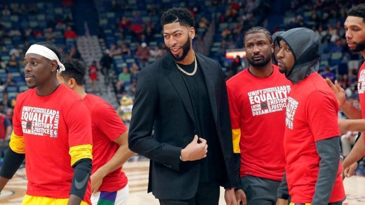 New Orleans Pelicans forward Anthony Davis huddles with teammates on the court before a game against the Indiana Pacers on Monday.