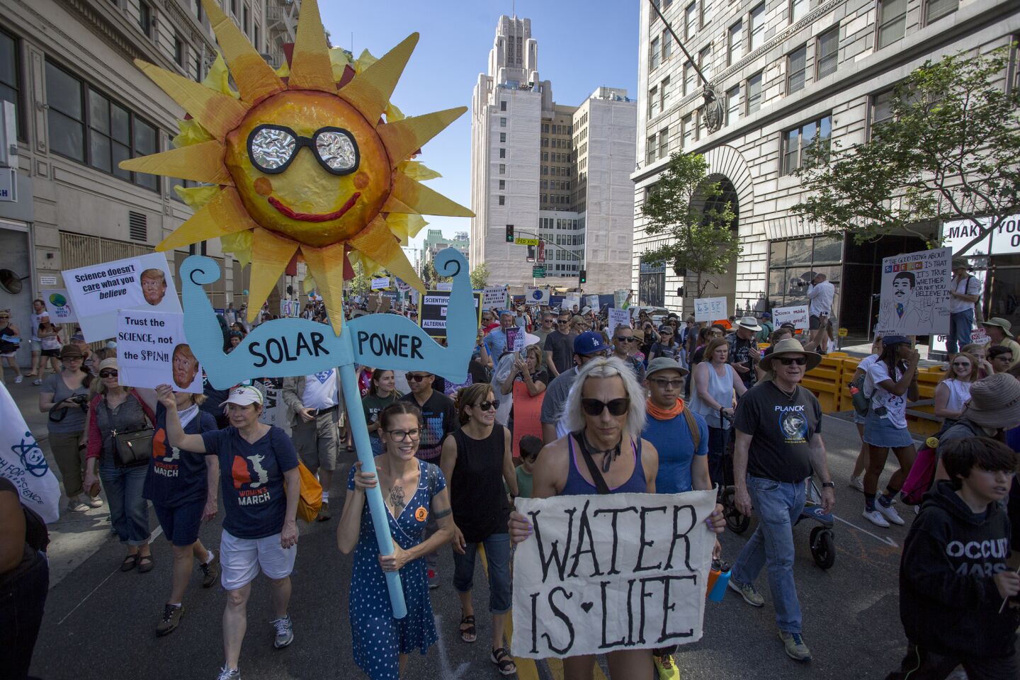 People participate in the L.A. March for Science. Marchers in Los Angeles include scientists, educators, students, advocates, and community leaders.