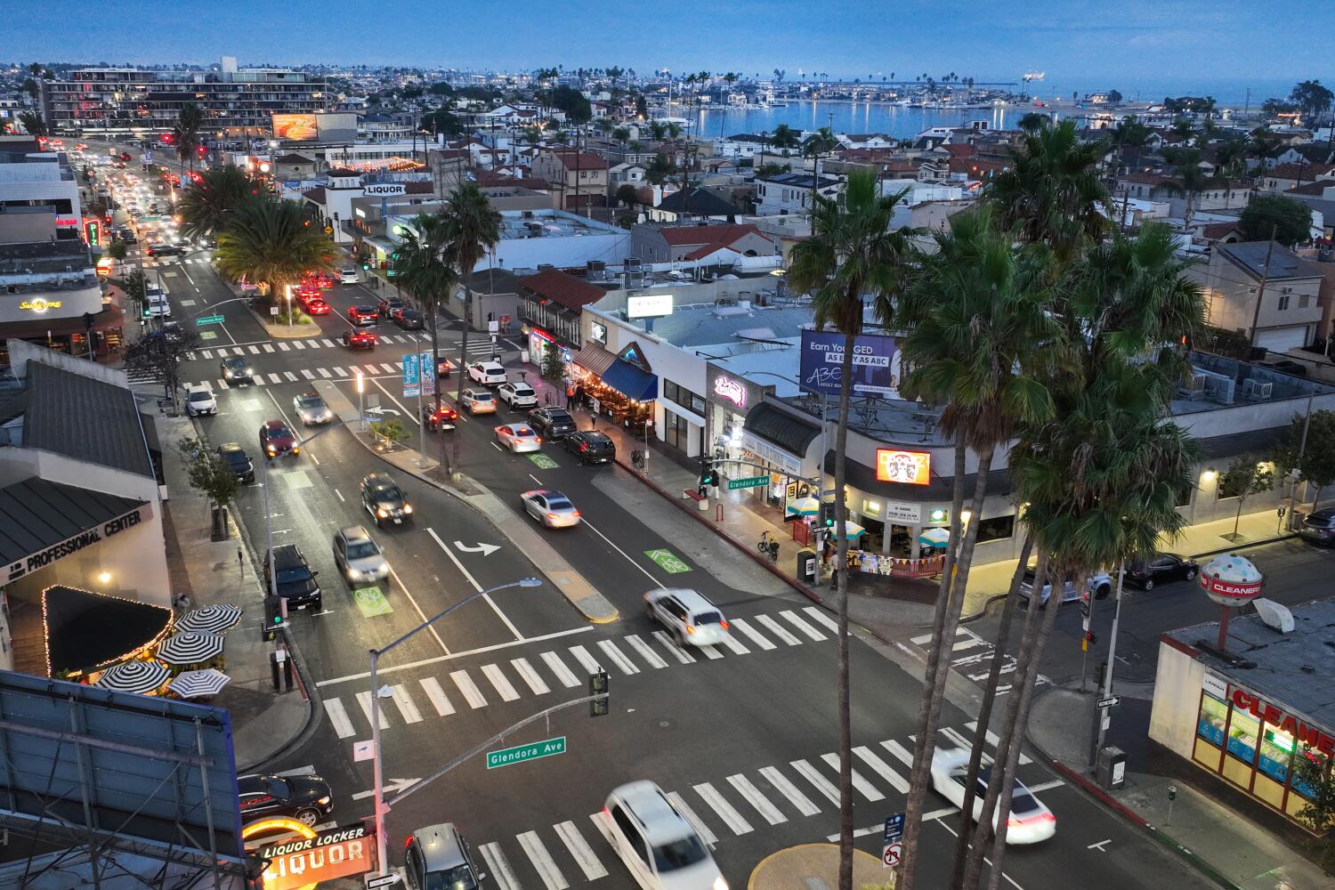 Belmont Shore, CA - November 13: An aerial view of Dogz Bar & Grill, which is one of four in Long Beach's Belmont Shore area that agree to a 30-day change of operating hours, closing at midnight, rather than 2 a.m. in in Belmont Shore Thursday, Nov. 13, 2025. On Tuesday, the bar was one of four in the city of Long Beach's Belmont Shore area to agree to a 30-day change of operating hours. Legend's, along with Shannon's Bayshore Saloon, Dogz Bar & Grill, and Panama Joe's are closing at midnight, rather than 2 a.m. Local residents are claiming Belmont Shore has become too dangerous, including public drunkenness and late night music. A 32-year-old man, Jeremy Spears, was killed in Belmont Shore in late October after a spat. (Allen J. Schaben / Los Angeles Times)