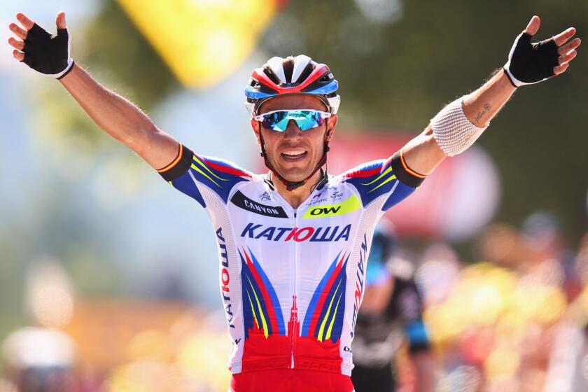 Joaquim Rodriguez celebrates after winning the third stage of the Tour de France in Huy, Belgium, on Monday.
