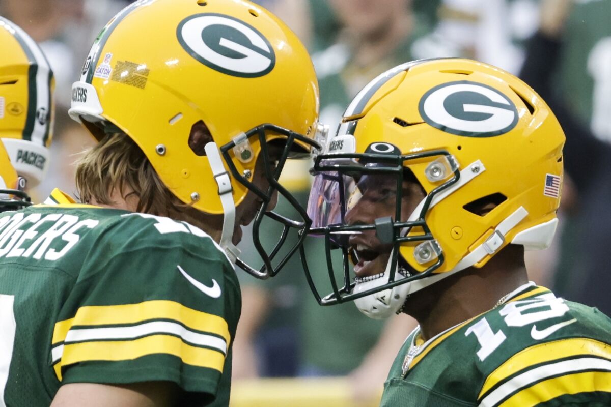 Green Bay Packers' Randall Cobb celebrates his touchdown catch with Aaron Rodgers during the first half of an NFL football game against the Pittsburgh Steelers Sunday, Oct. 3, 2021, in Green Bay, Wis. (AP Photo/Mike Roemer)