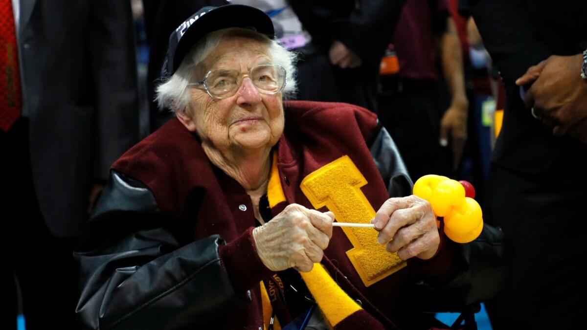 Sister Jean Dolores-Schmidt celebrates with the Loyola Ramblers after their win over Kansas State on March 24.