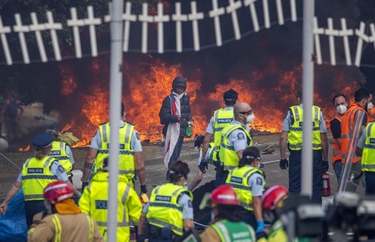 Police officers at the scene of a fire