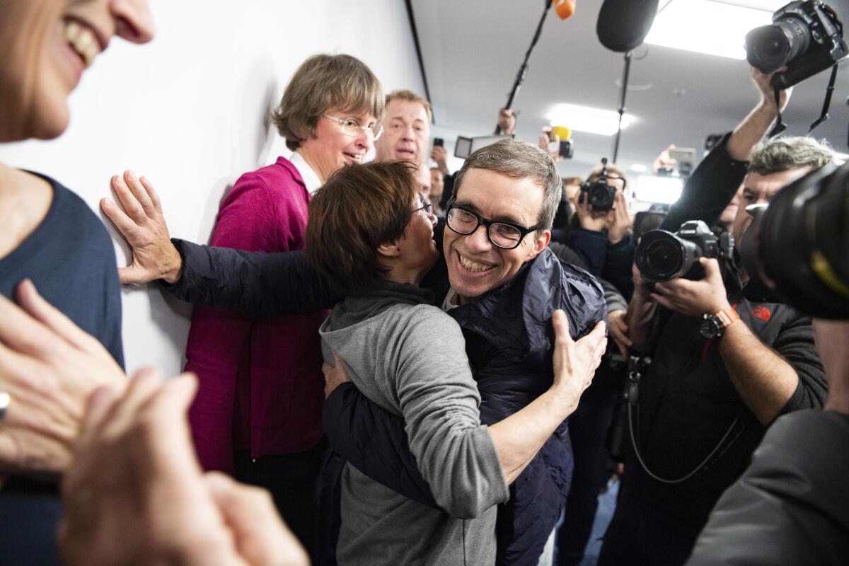 Jens Soering, center, arrives at Frankfurt Airport in Germany on Dec. 17, 2019.