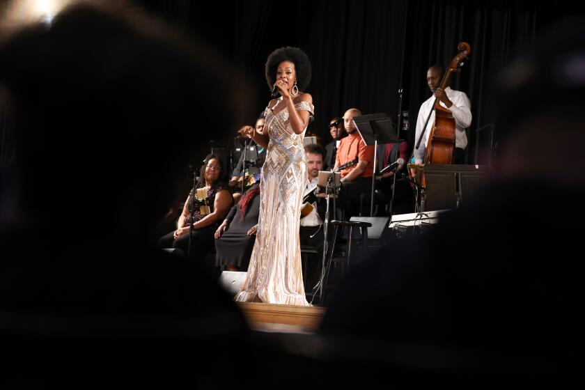Los Angeles, CA - September 09: Sy Smith sings during a performance with the Pasadena nonprofit MUSE/IQUE coined "The Songs and Stories of Central Avenue," at Jefferson High School on Friday, Sept. 9, 2022 in Los Angeles, CA. The school's principal, Dr. Tamai Johnson hopes the performance will inspire students as many Jazz greats, including Ella Fitzgerald and Dexter Gordon were graduates of Jefferson High School. (Dania Maxwell / Los Angeles Times)