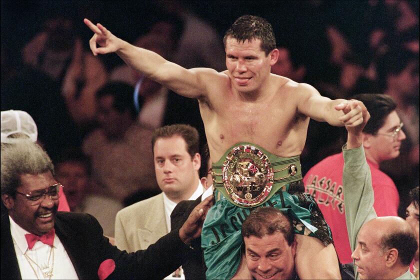 LAS VEGAS, NV - APRIL 8: WBC super lightweight champion Julio Cesar Chavez of Mexico celebrates after he retained his title with a unanimous 12-round decision over Giovanni Parisi of Italy 08 April 1995 in their fight at Caesars Palace in Las Vegas. It was the 33rd title fight for Chavez. (Photo credit should read JOHN GURZINSKI/AFP via Getty Images)