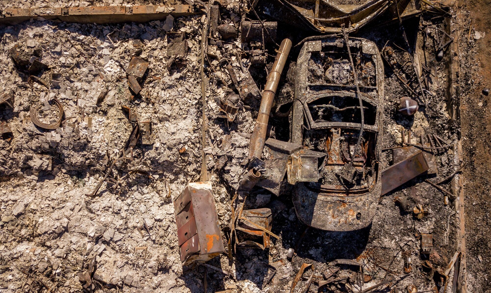 The remains of a burnt vehicle, seen from above.