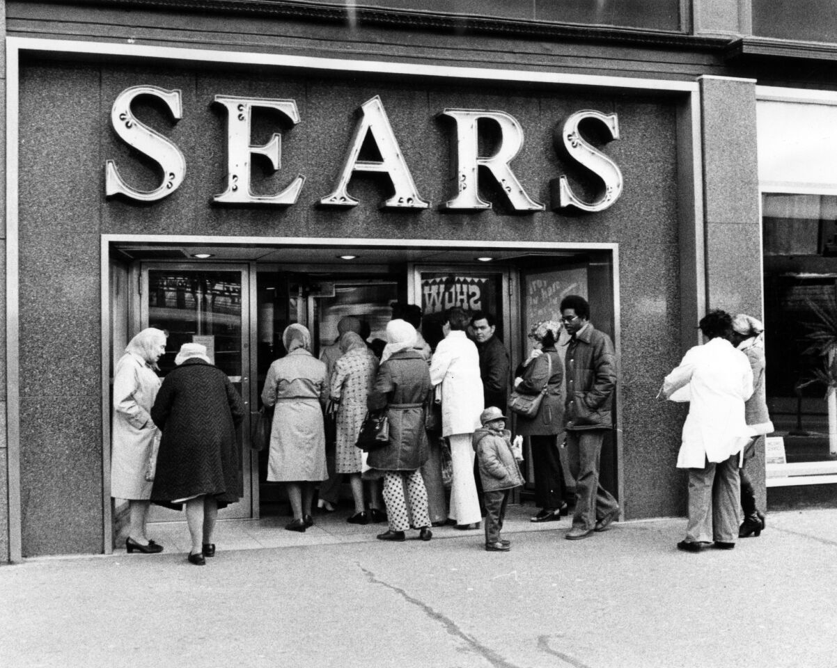 People wait to get into the remodeled Sears store at State Street and Congress on April 11, 1978. Mayor Michael Bilandic was walking through the store.