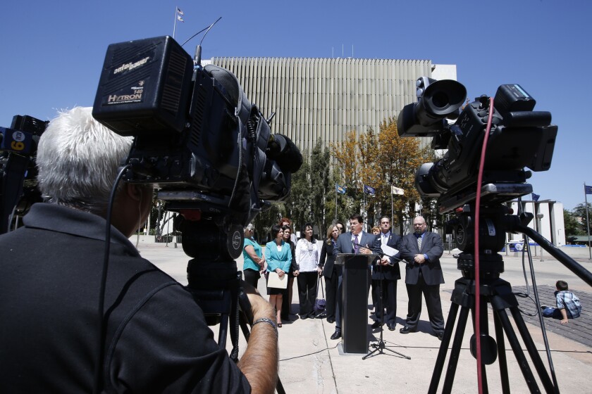 Three members of the Orange County Board of Supervisors held a news conference April 9 to ask for the resignation of Superior Court Judge M. Marc Kelly over his sentencing of a man in a child molestation case.