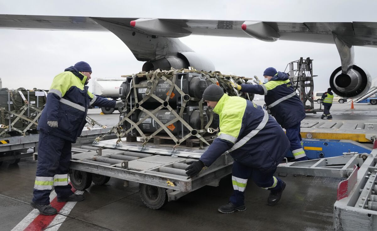 A shipment of military aid from the U.S. is unloaded Friday at an airport outside Kyiv, Ukraine.