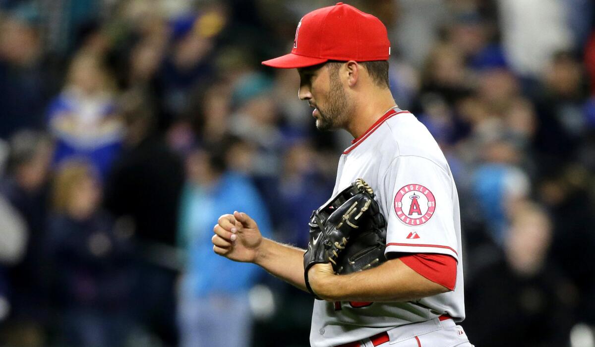 Angels closer Huston Street pumps his fist after recording the final out in a 5-3 win over the Mariners on April 8 in Seattle.