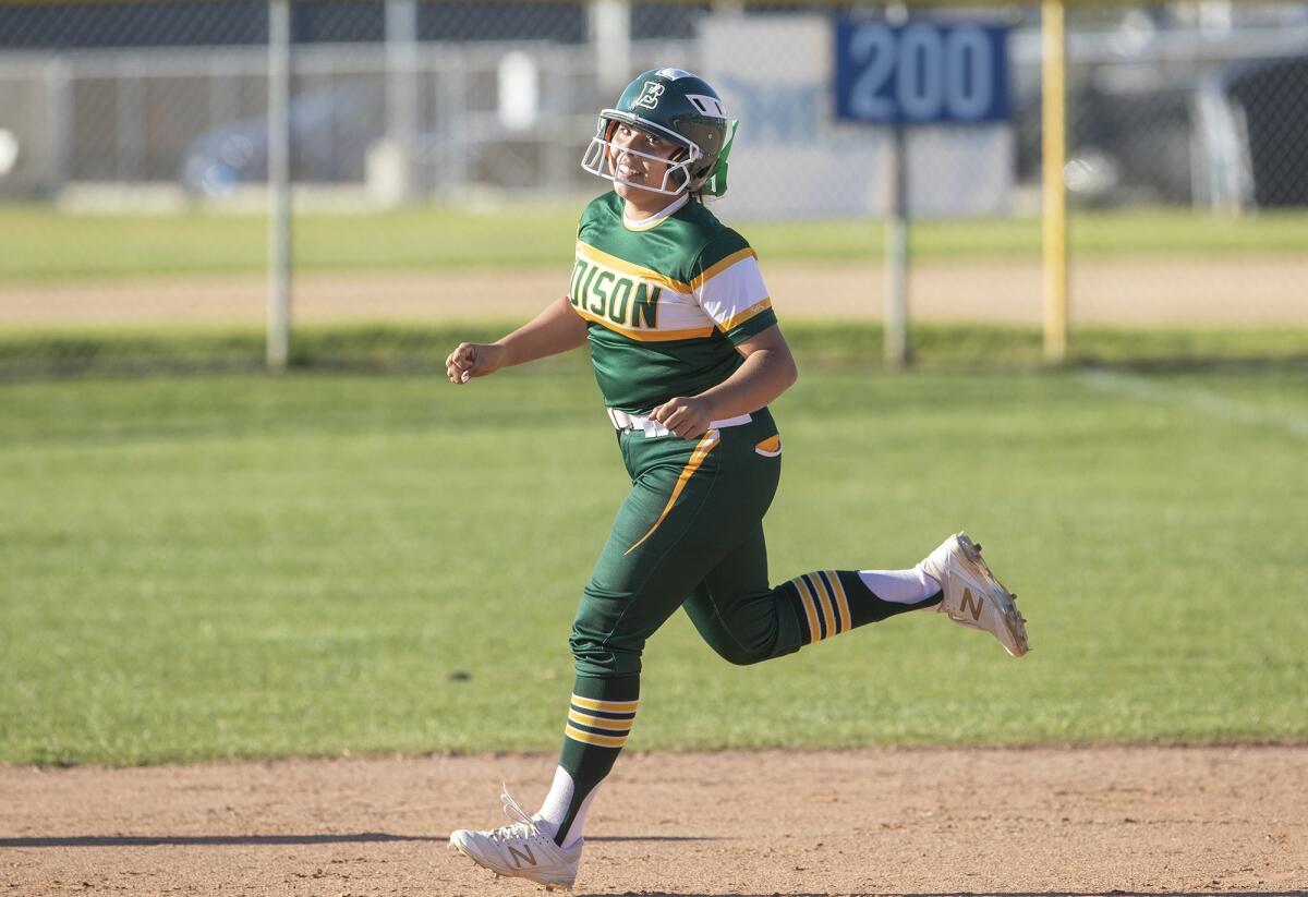 Edison High's Isabella Martinez rounds second after hitting a home run in the seventh inning of a Sunset Conference crossover game at Newport Harbor on Thursday.