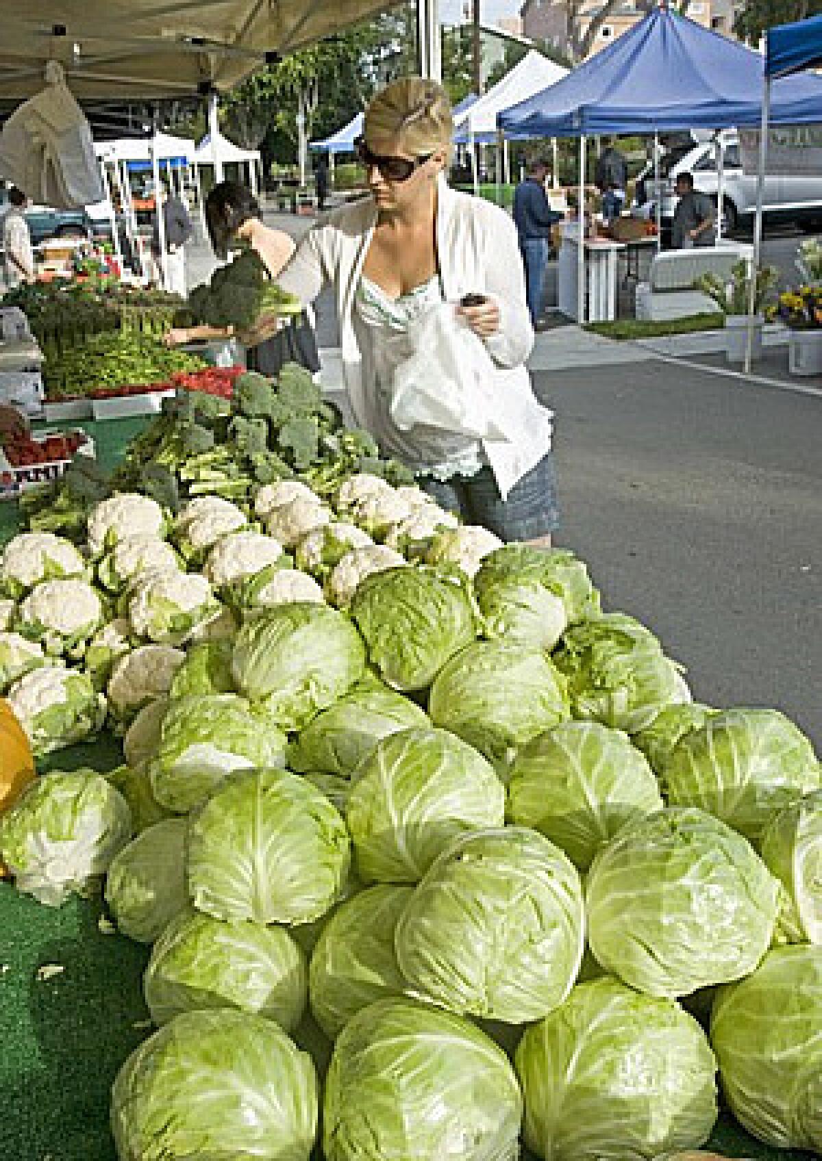 Smith Farms, which grows locally in Trabuco Canyon, Orange County, sells a wide range of vegetables, including green cabbage, iceberg lettuce, cauliflower and broccoli; at the Corona del Mar farmers market.