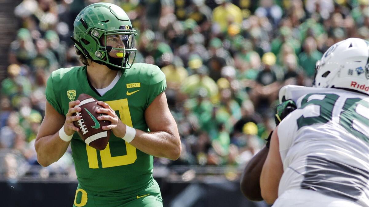 Oregon quarterback Justin Herbert looks for a receiver against Portland State during a game on Sept. 8.