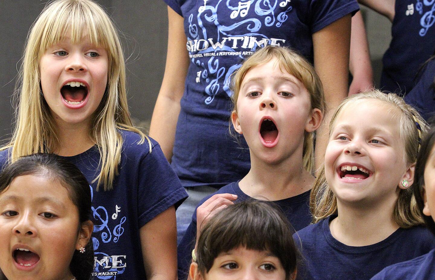 Roxy Igoe, 9, and Catherine Dietschek, 9, and Peyton Tribble, 9, of Showtime, the school's show choir, rehearses "Roar" in the chorus room at Mark Keppel Mark Keppel Visual and Performing Arts Magnet School in Glendale on Tuesday, January 28, 2014. This year is the first one for the show choir, and one of only a few elementary school show choirs in the area. (Tim Berger/Staff Photographer)