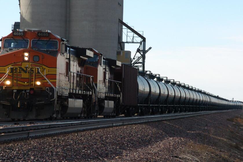 A BNSF Railway train hauls crude oil west of Wolf Point, Mont. The rail company has agreed to pay $140,000 in penalties, medical expenses and emergency response costs stemming from a 2012 spill of hazardous chemicals near the Port of Los Angeles, the city attorney announced this week.