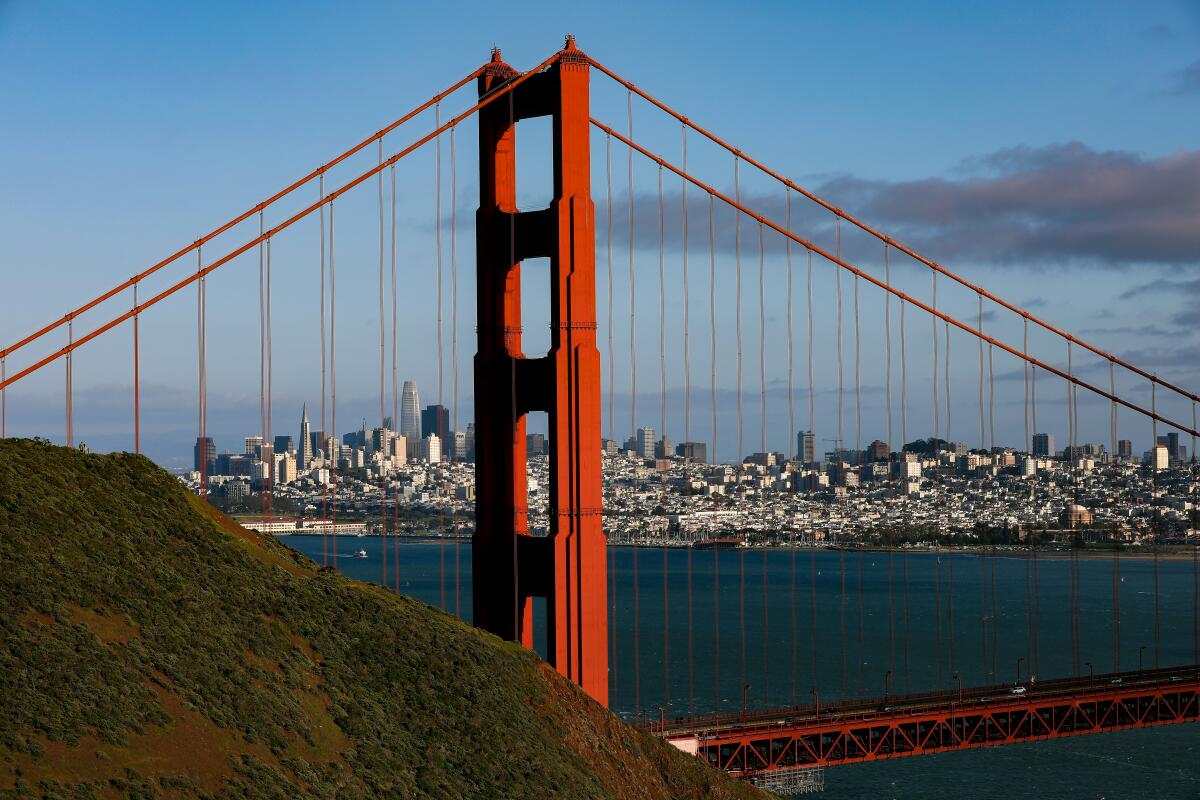 The Golden Gate Bridge with the San Francisco skyline in the background.