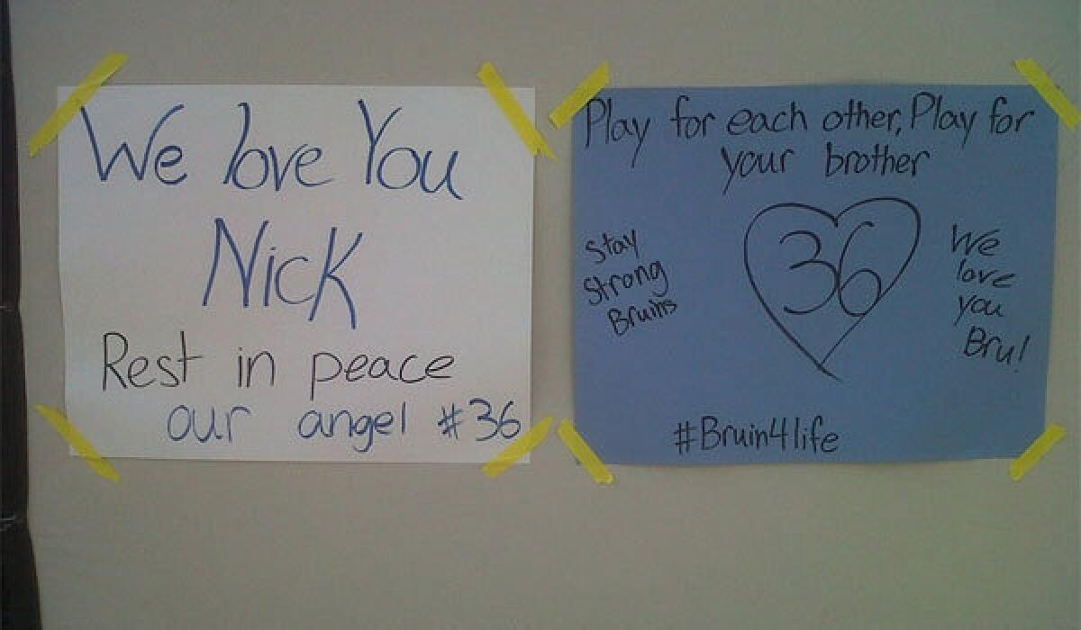 Handmade signs for UCLA receiver Nick Pasquale, who died after being hit by a car, were on display outside the Bruins' practice facility.