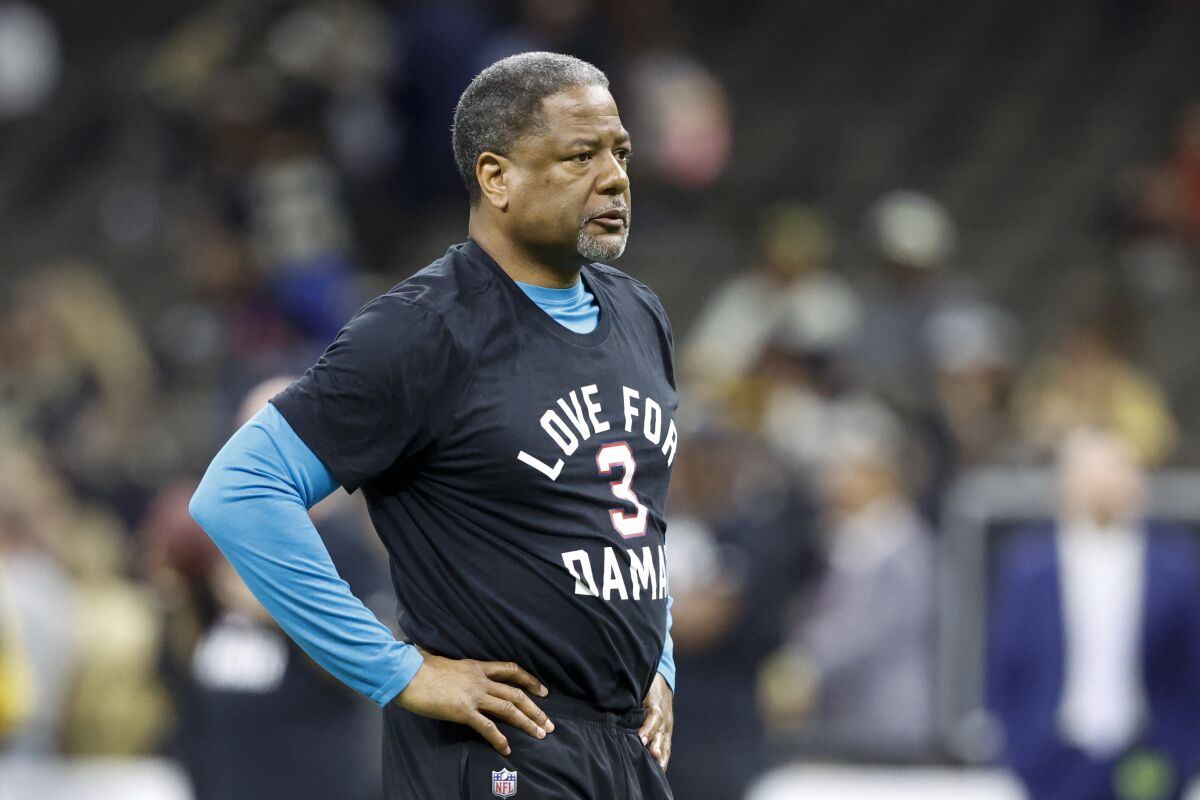 FILE - Carolina Panthers' Steve Wilks warms up wearing a T-shirt in support of Buffalo Bills player Damar Hamlin before an NFL football game between the Panthers and the New Orleans Saints in New Orleans, Sunday, Jan. 8, 2023. Former Carolina Panthers interim head coach Steve Wilks Tweeted “disappointed, but not defeated” that he didn’t landed the team’s full-time head coaching position. The Panthers announced on Thursday, Jan. 26 they've agreed to hire Frank Reich as their new head coach.(AP Photo/Butch Dill, File)