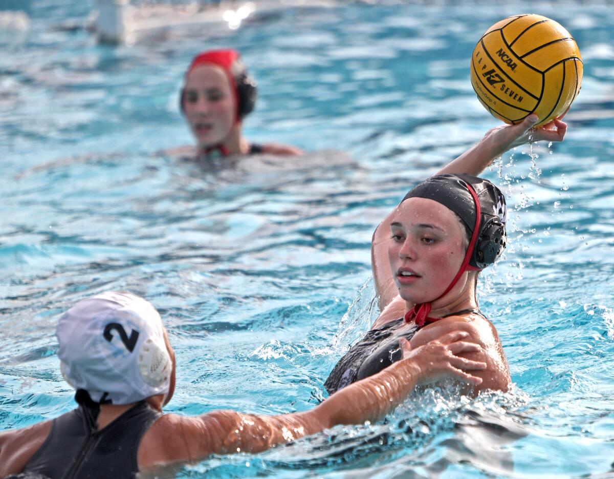 Flintridge Sacred Heart Academy water polo player Fanny Christensen attempts a shot on goal in home game vs. Marymount, in La Canada Flintridge on Thursday, Jan. 30, 2020.