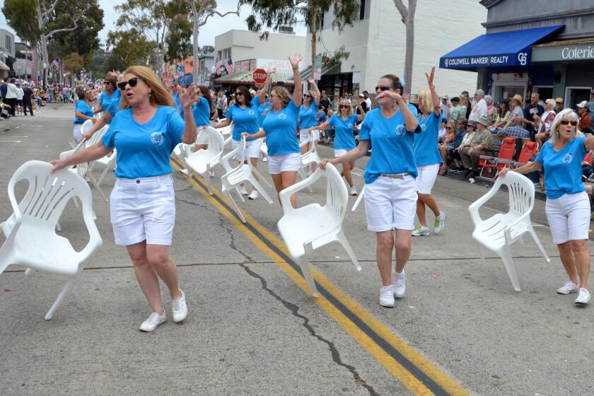 The Patio Chair Drill Team dance along Marine Avenue at the Balboa Island Parade Sunday.
