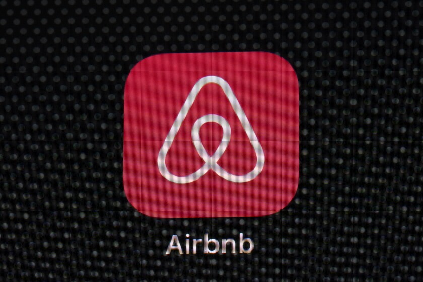 The Airbnb app icon is seen on an iPad screen, Saturday, May 8, 2021, in Washington. Airbnb reported Thursday, May 13 that its first-quarter loss more than tripled, to $1.17 billion, as travel remained depressed by the pandemic, but revenue topped the same period in 2019. (AP Photo/Patrick Semansky)