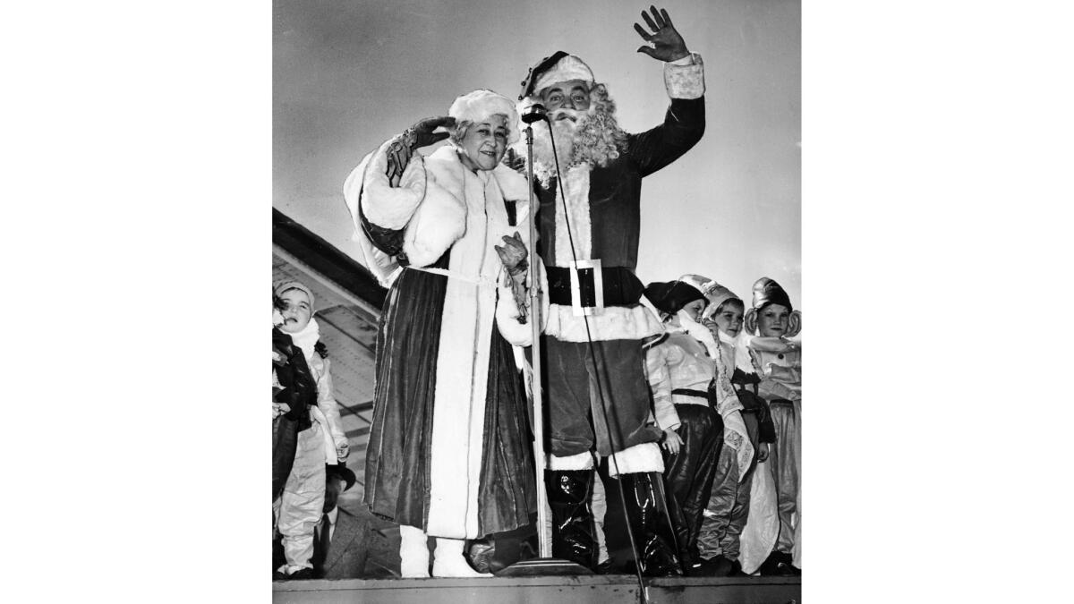 Nov. 23, 1939: Santa and Mrs. Claus wave to the crowd upon arrival at Union Air Terminal after their flight from the "North Pole."