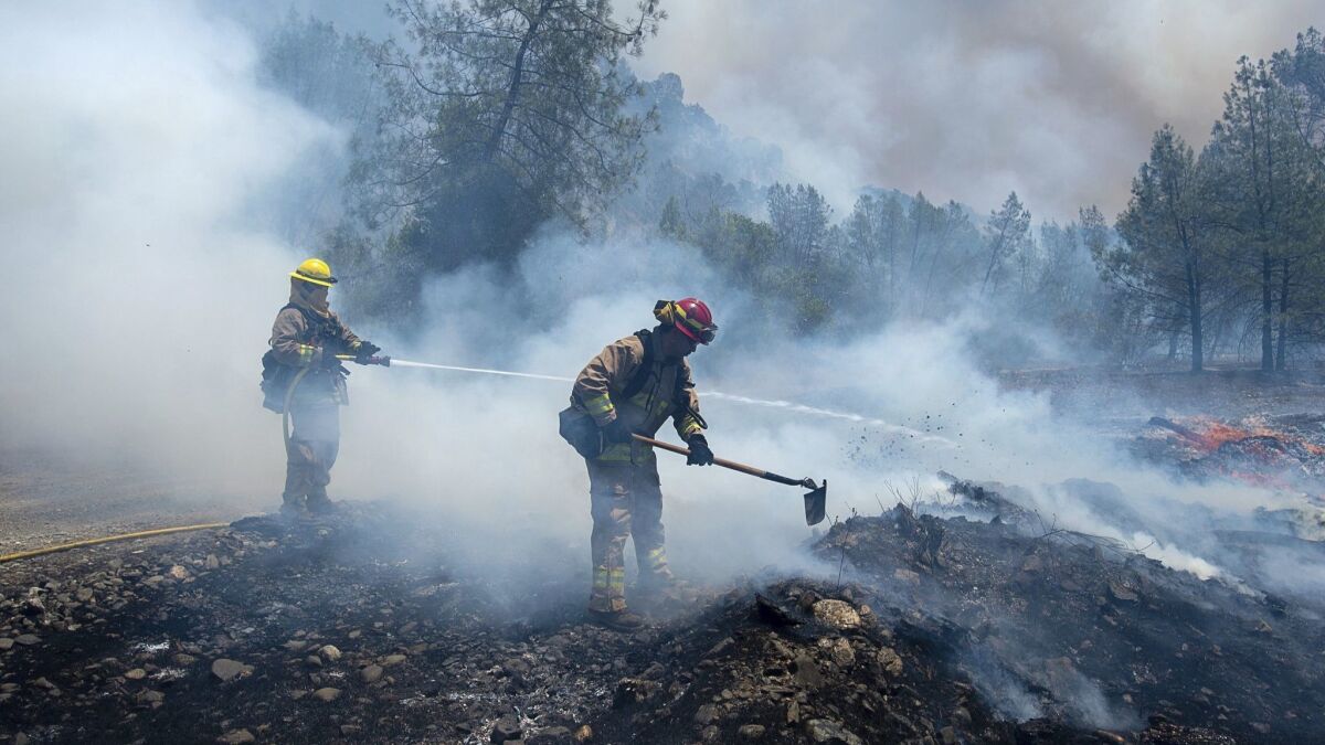 Firefighters mop up hot spots on the fringe of the Pawnee fire in Lake County, which is still recovering from previous severe blazes.