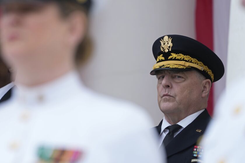 FILE - Chairman of the Joint Chiefs of Staff Gen. Mark Milley listens during an event at the Memorial Amphitheater of Arlington National Cemetery in Arlington, Va., on Memorial Day, on May 29, 2023. The chairman of the Joint Chiefs of Staff, Gen. Mark Milley, says the main battle tanks and fighter jets the U.S. has promised to Ukraine won’t be ready in time for the imminent counteroffensive against Russia. Tank warfare will be key to Ukraine pushing Russia out of its territory, and the U.S. has begun training Ukrainian troops on M1A1 Abrams battle tank tactics. (AP Photo/Susan Walsh, File)