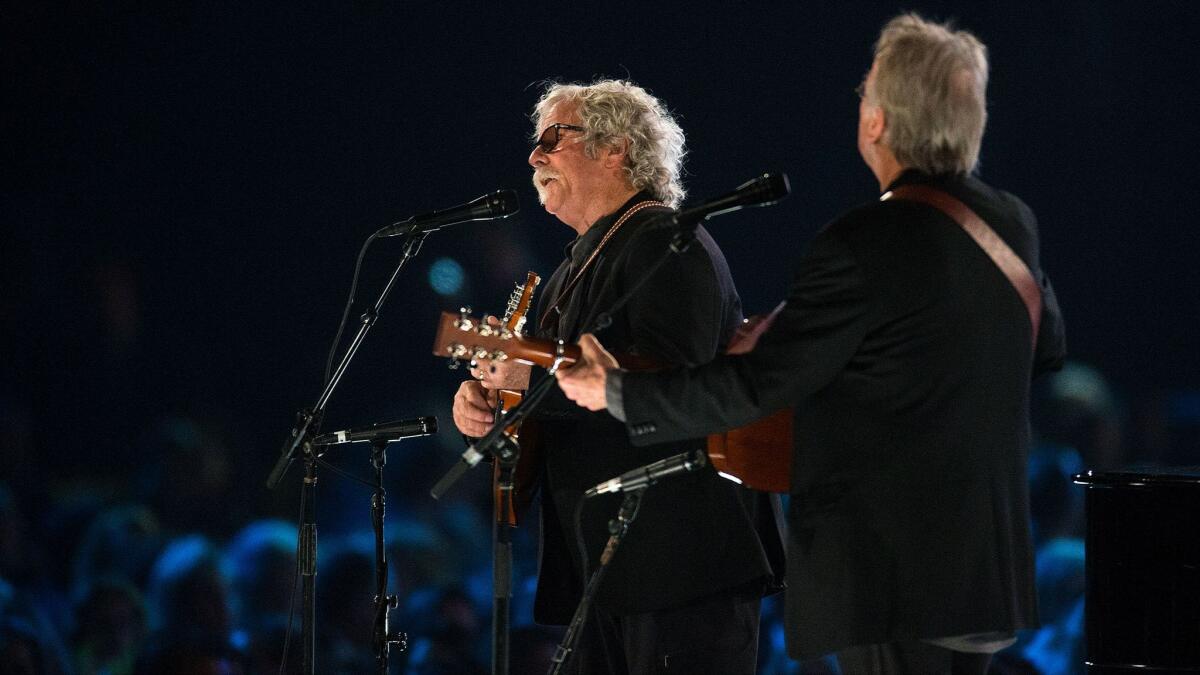 Chris Hillman, center, and Herb Pedersen showng perfomring in February in Los Angeles for the MusiCares Person of the Year salute to Tom Petty.