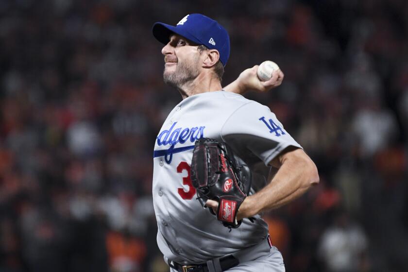 The Dodgers' Max Scherzer pitches in Game 5 of the National League Division Series at San Francisco on Oct. 14, 2021.