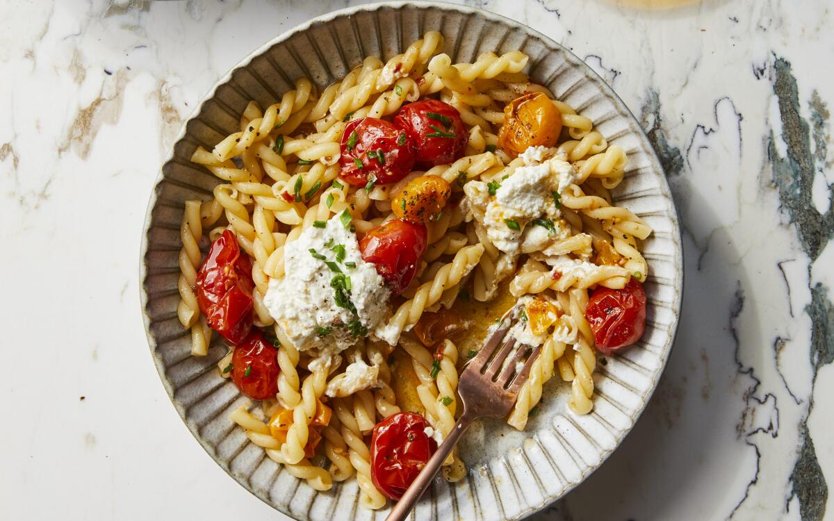Slow-roasted tomatoes turn cooked pasta and ricotta into an instant, easy dinner.