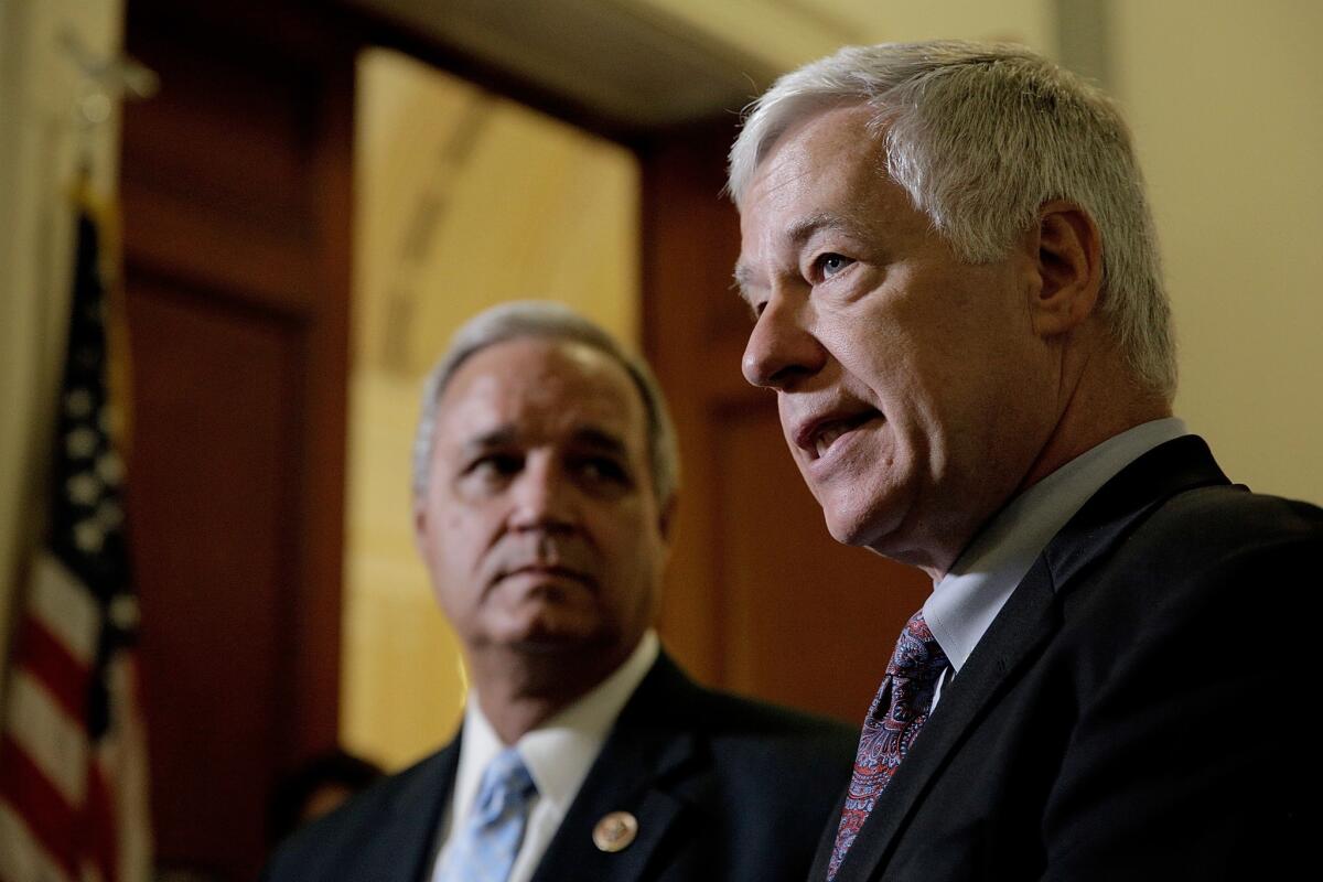 Rep. Michael Michaud (D-ME) (R), ranking member of the the House Veterans' Affairs Committee, and Rep. Jeff Miller (R-FL), committee chairman, speak to the press following a hearing during which the committee voted to issue subpoenas compelling the testimony of VA officials regarding the destruction of a wait list for the Phoenix VA Health Care System on May 22, 2014 in Washington, DC.