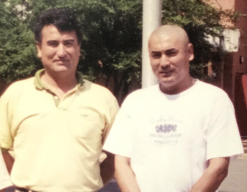 Tiyip Tashpolat, left, with his brother Nury. 
