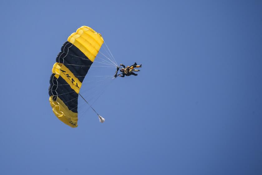 David Ross skydives with the U.S. Army Golden Knights parachute team during the opening of the first day of the Chicago Air and Water Show on Saturday, Aug. 19, 2017.
