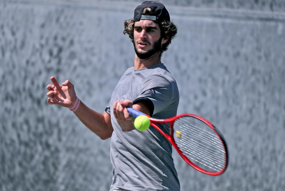 Max McKennon practices at the Racquet Club of Irvine on Sept. 23 for the French Open.