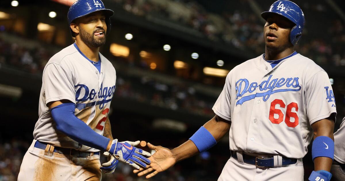 The Los Angeles Dodgers' Matt Kemp celebrates after his fifth