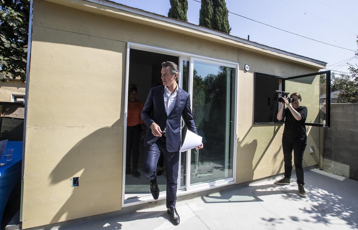 Gov. Gavin Newsom exits an accessory dwelling unit in South L.A.