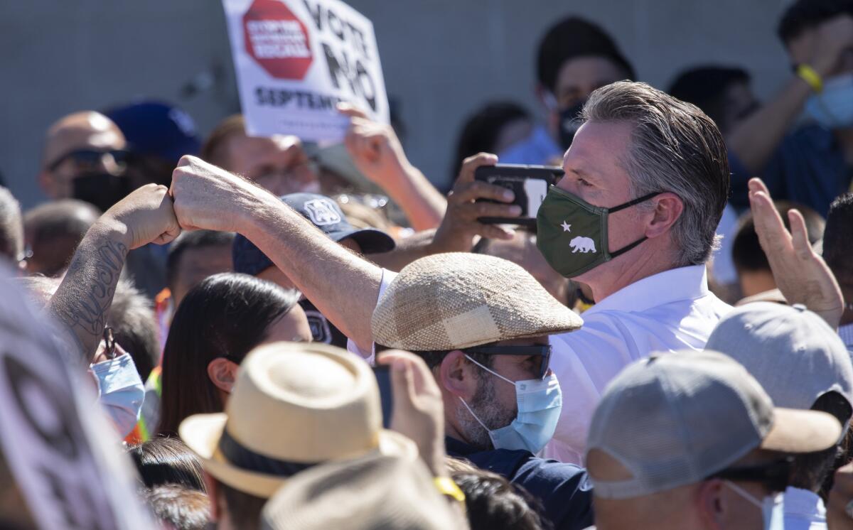 Gov. Gavin Newsom greets a crowd in Sun Valley. 