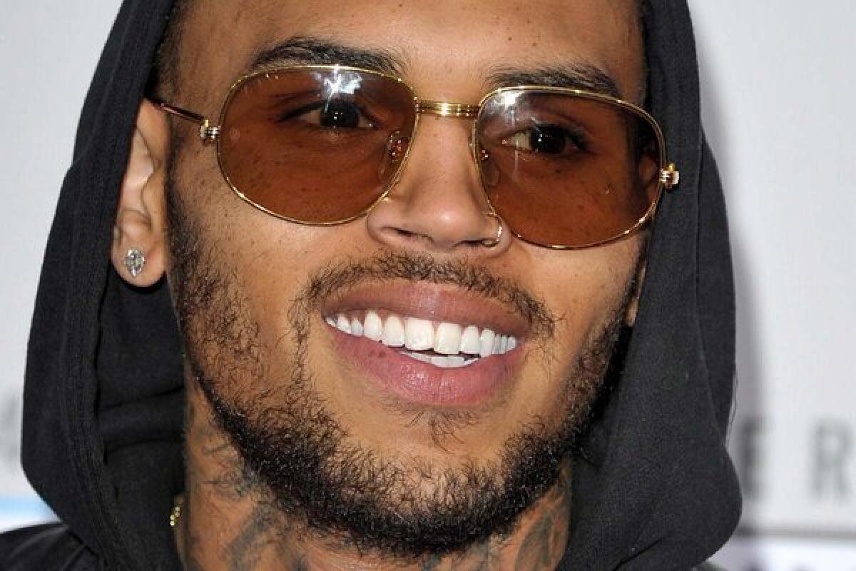 Chris Brown quit Twitter for a stretch Sunday after launching into a vulgar tirade against a female comedian who'd insulted him.