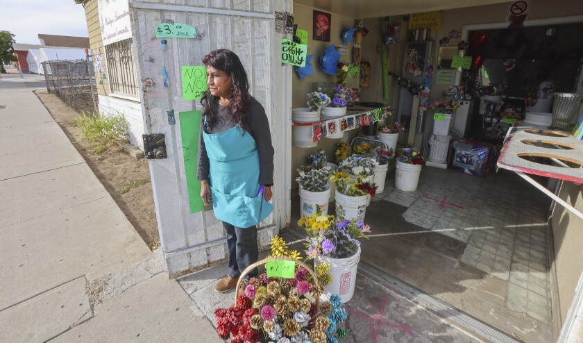 Florist Silvia Perez stands at her Flower of the Mountain flower shop.