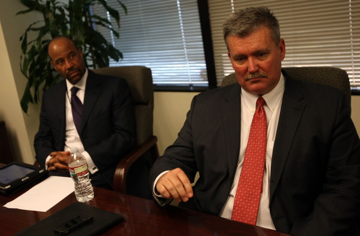 David R. Holmquist, general counsel for the Los Angeles Unified School District, right, and Greg McNair are two of the LAUSD lawyers accused of bullying and intimidating a student who alleged sexual assault.