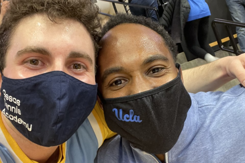 UCLA fan Ryan Gesas and UCLA athletic director Martin Jarmond.