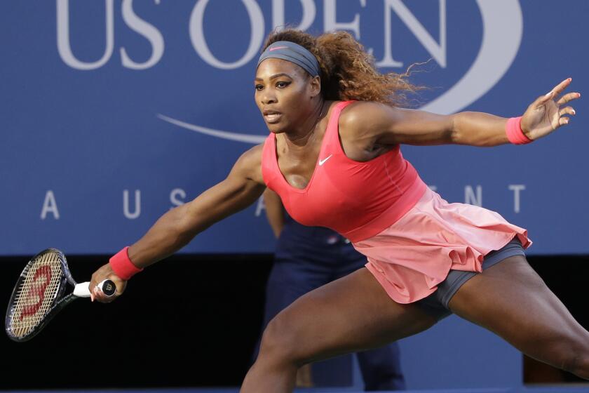 FILE - Serena Williams returns a shot to Victoria Azarenka, of Belarus, during the women's singles final.