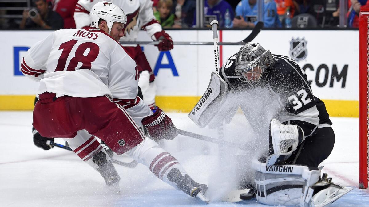 Kings goalie Jonathan Quick makes a save on a shot by Arizona Coyotes right wing David Moss during the Kings' 4-2 win at Staples Center on Saturday.