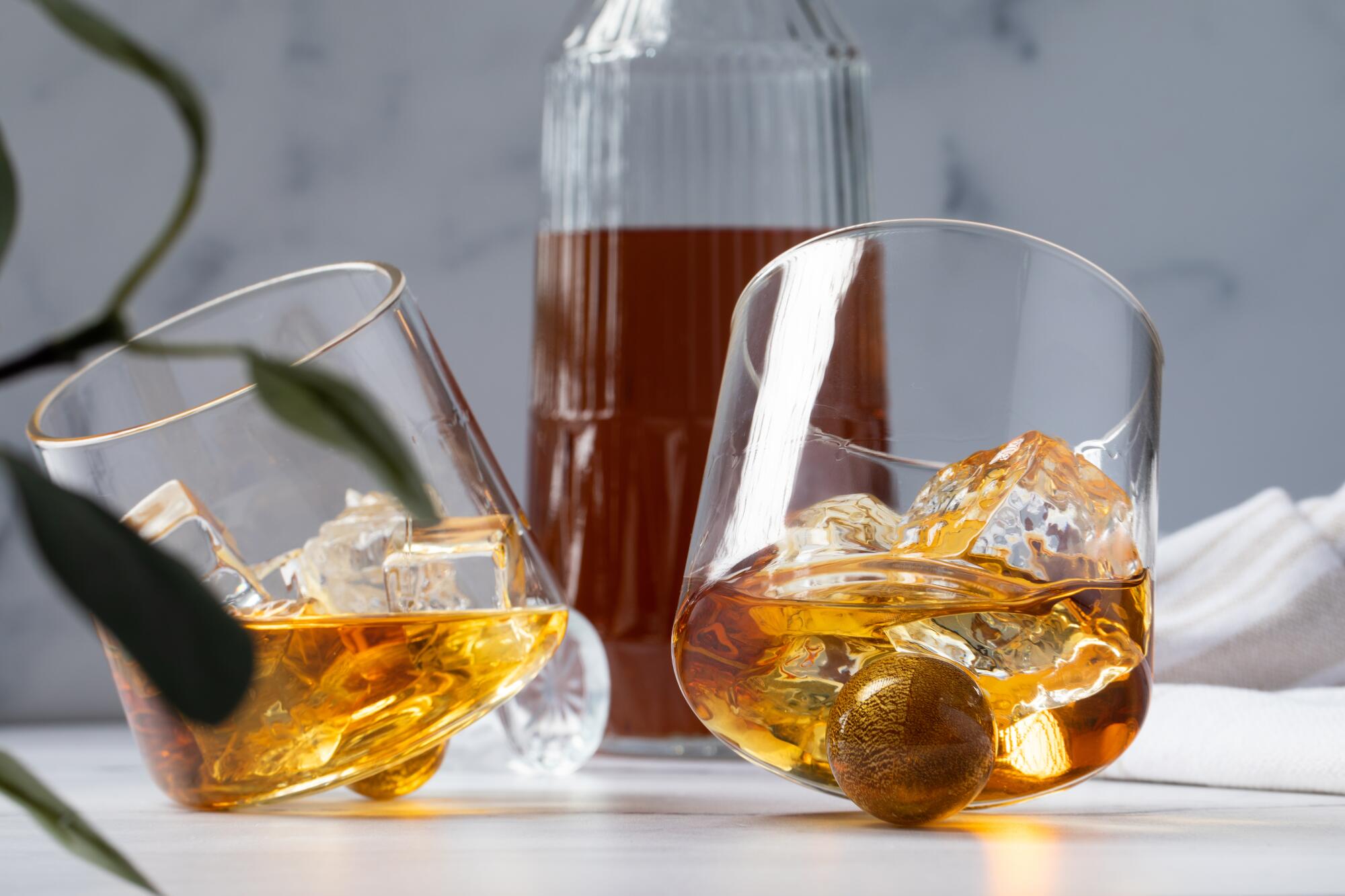 Two glasses leaning on a ball