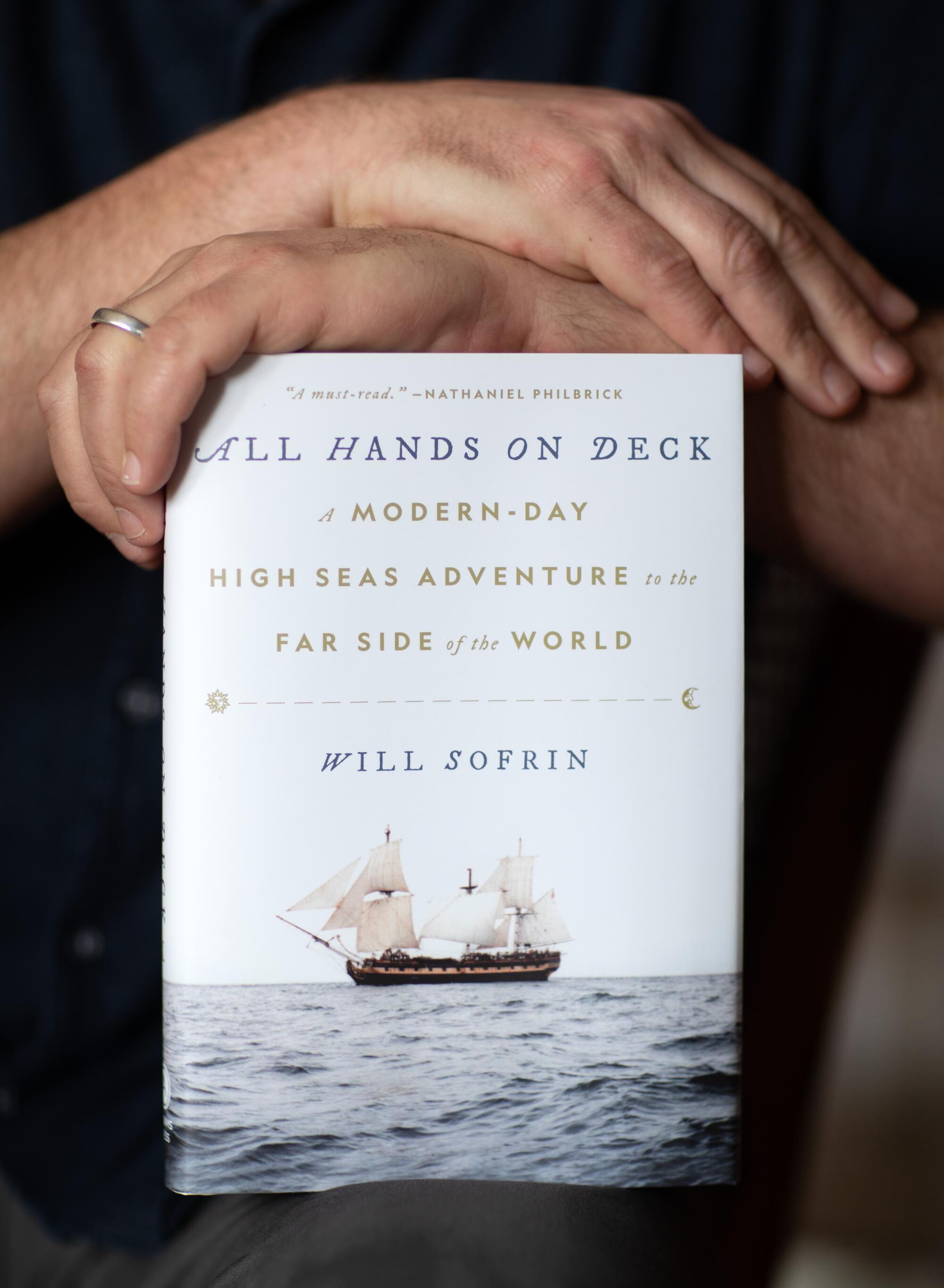 A copy of the book "All Hands on Deck."