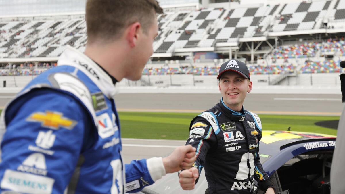 Alex Bowman, left, congratulates Daytona 500 pole winner William Byron after their qualifying runs Feb. 10 at Daytona International Speedway.