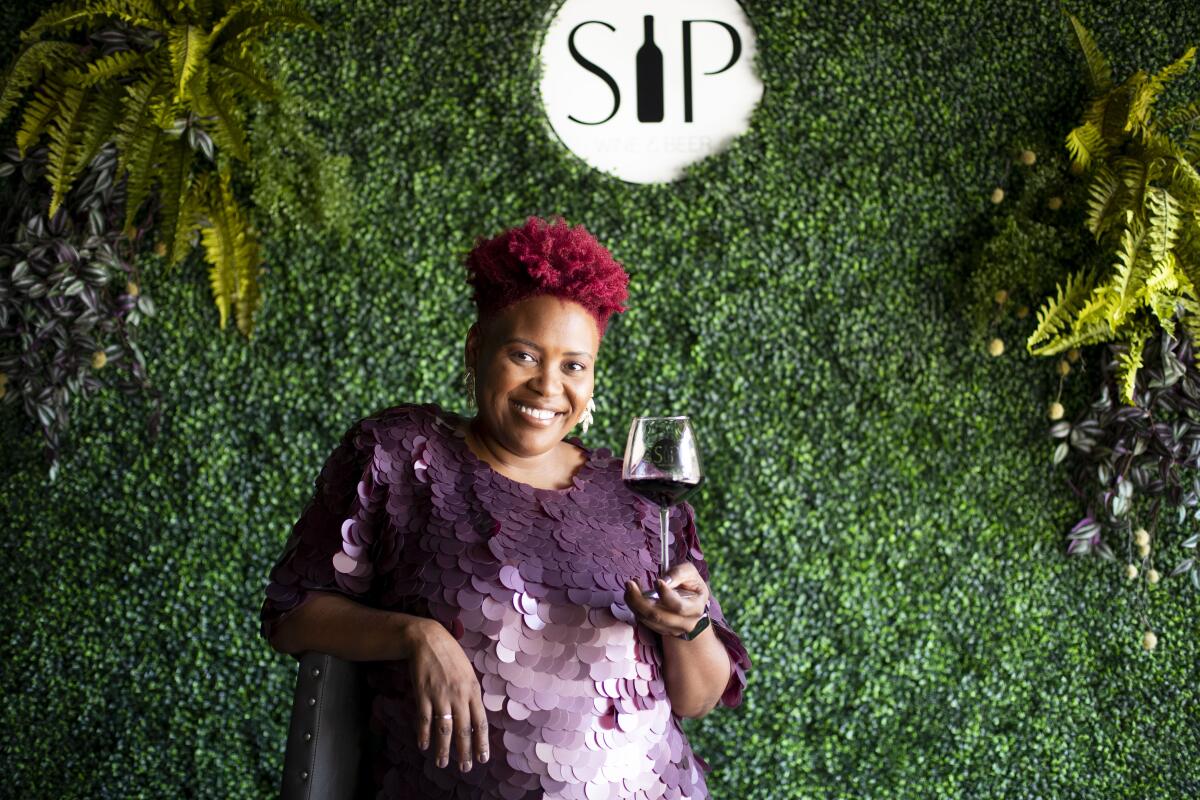 Cassandra Schaeg with a glass of wine at SIP Wine & Beer